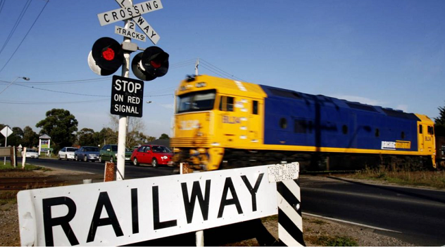 Freight train crossing a rail crossing