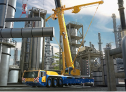 Yellow crane at an oil refinery with both booms extended