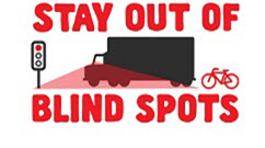 Image of a truck facing traffic lights with the words Stay out of blind spots