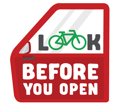 Image of a car door with the words Look before you open 