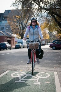 Woman riding bike in a bicycle lane