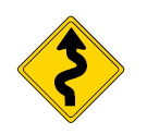 road sign telling drivers the the road ahead is winding and to be careful