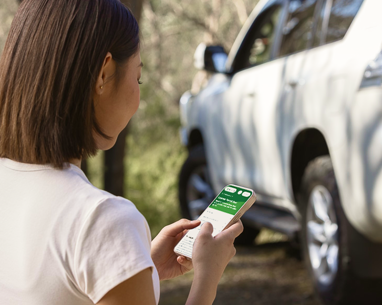 Girl checks the status of a car on her mobile. Check the registration status of any vehicle using our online tool.