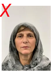 Unsuitable use of head covering in licence photo: Coverings must be a single colour, without patterns.