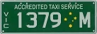 Sample image of a VicRoads metropolitan taxi number plate, used for taxis operating in metropolitan Victoria.